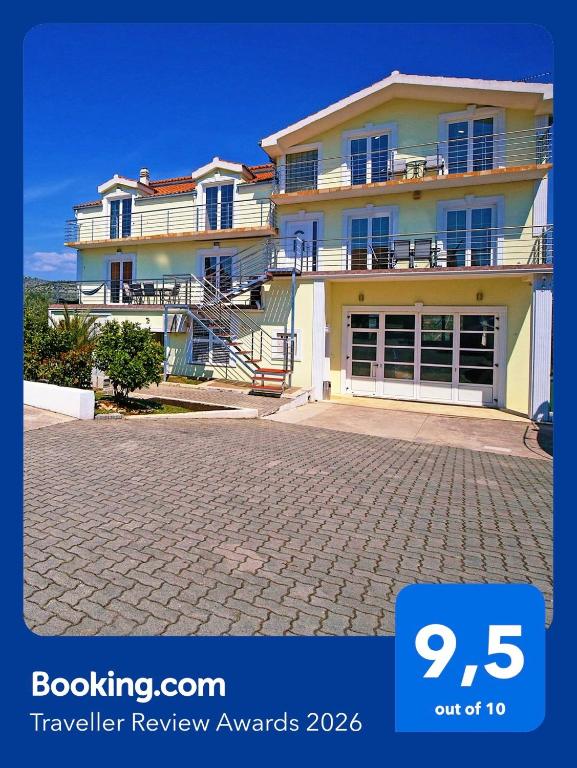 a large house with a driveway in front of it at Villa Tea in Donje Polje