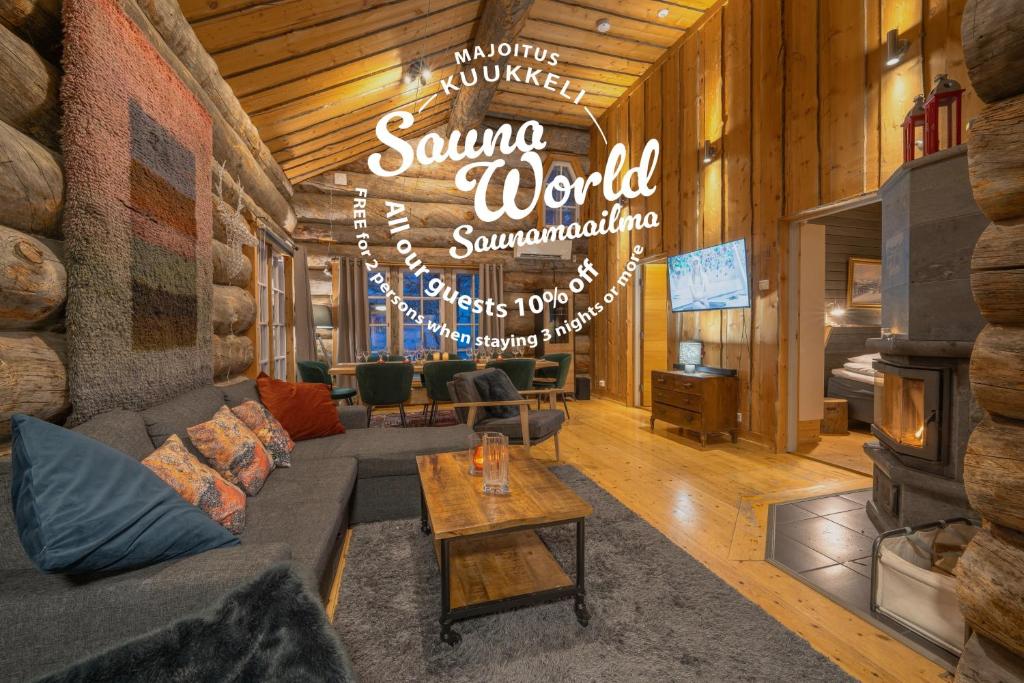 a living room with a couch and a sign that says some world championship at Kuukkeli Hirvas Suite in Saariselka