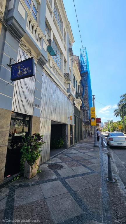 a building with a sign on the side of a street at Hotel Casa Blanca - Adults Only in Rio de Janeiro