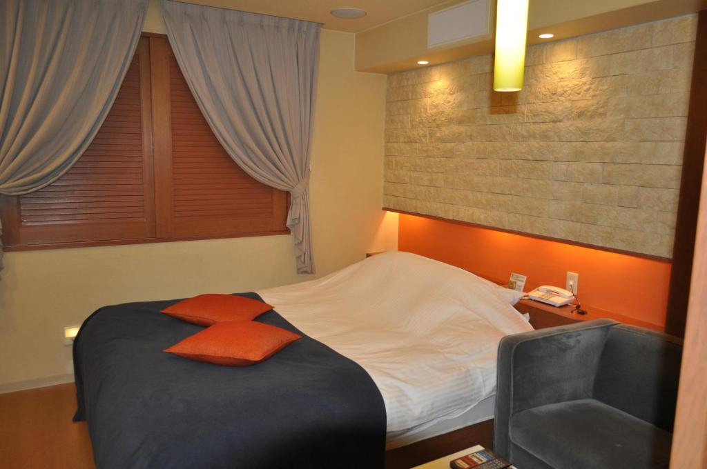Postel nebo postele na pokoji v ubytování Hotel Woo (Adults Only)