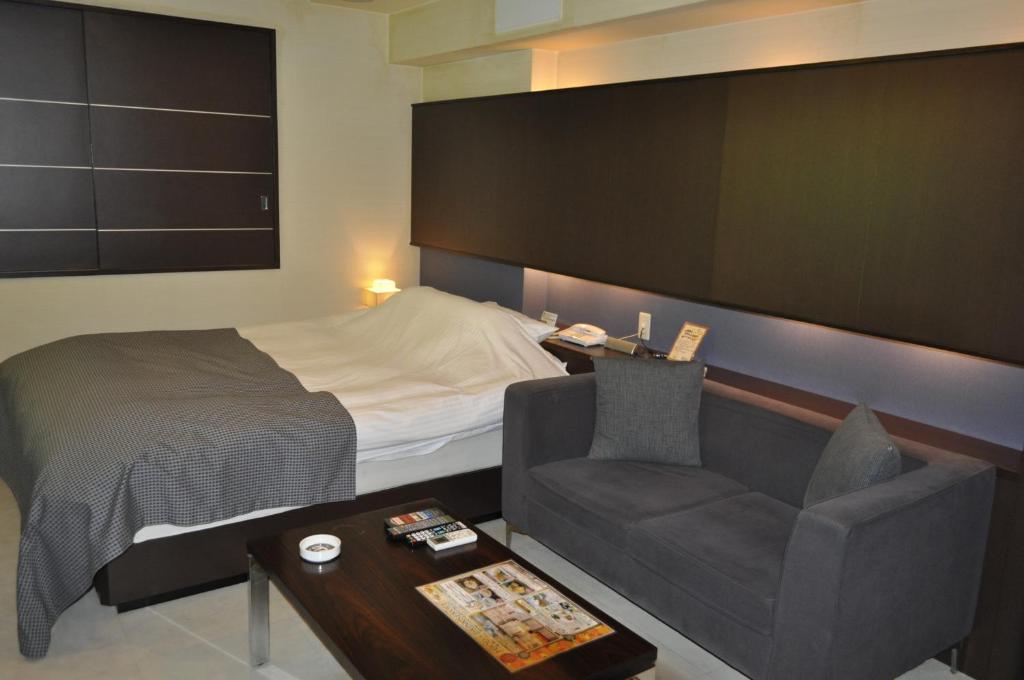 Postel nebo postele na pokoji v ubytování Hotel Woo (Adults Only)