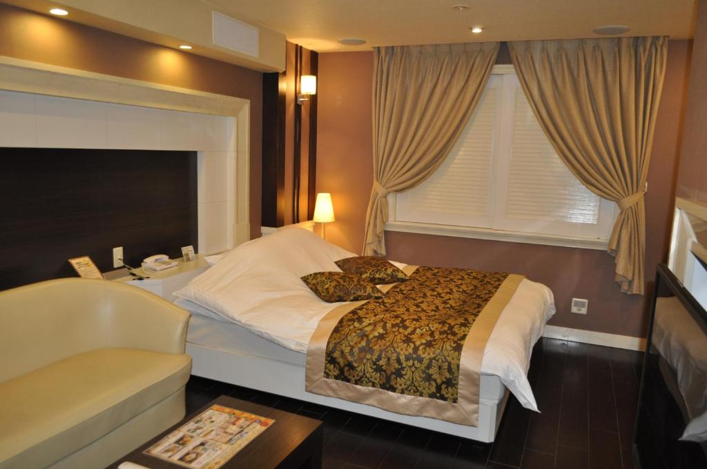 Postel nebo postele na pokoji v ubytování Hotel Woo (Adults Only)
