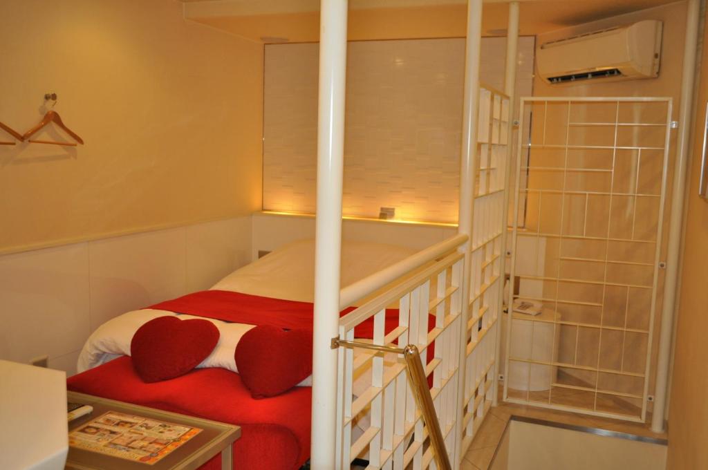 Postel nebo postele na pokoji v ubytování Hotel Woo (Adults Only)