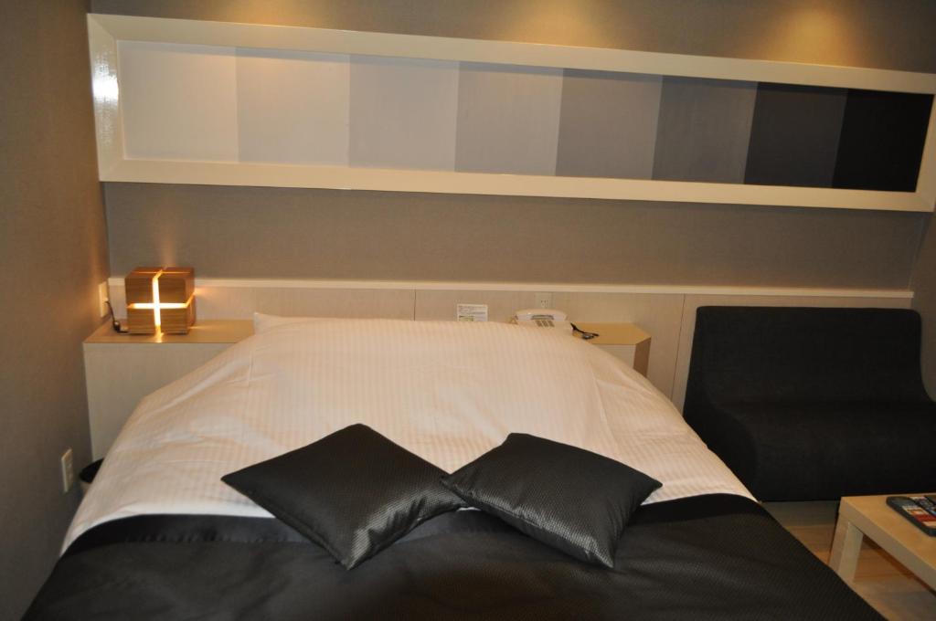 Postel nebo postele na pokoji v ubytování Hotel Woo (Adults Only)