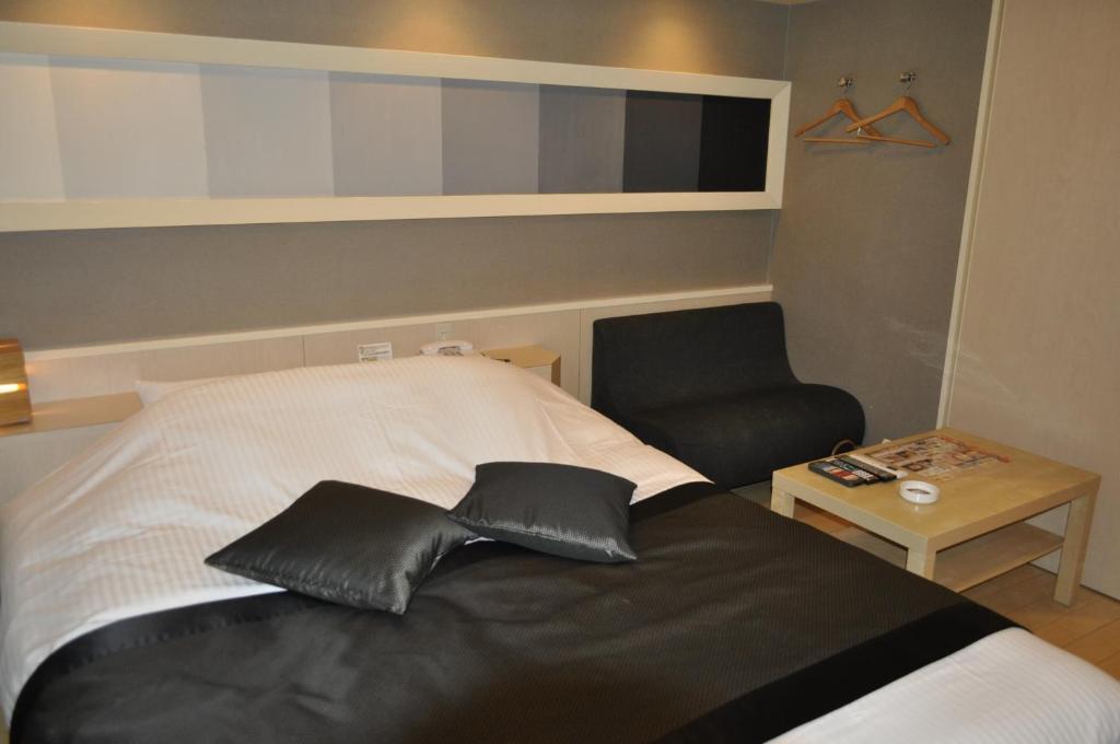 Postel nebo postele na pokoji v ubytování Hotel Woo (Adults Only)