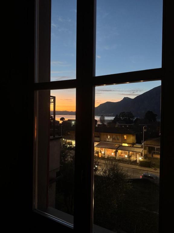 an open window with a view of a city at Antica Casa Fenaroli in Iseo