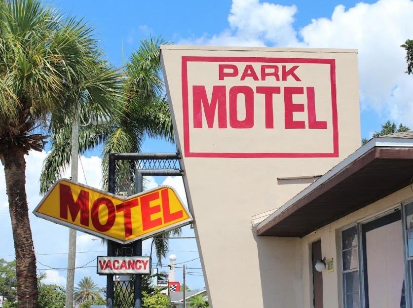 a park motel sign in front of a building at Park Motel in Tampa
