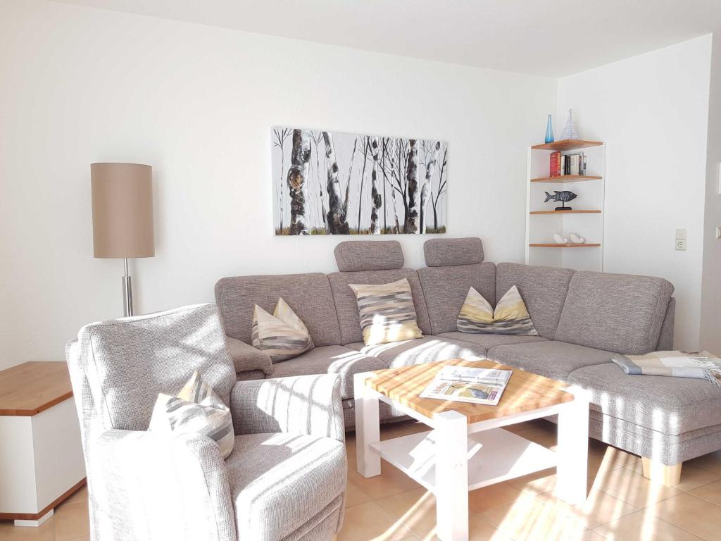 a living room with a couch and a table at Ferienwohnung 7 Katharina mit Balkon in Lauterbach