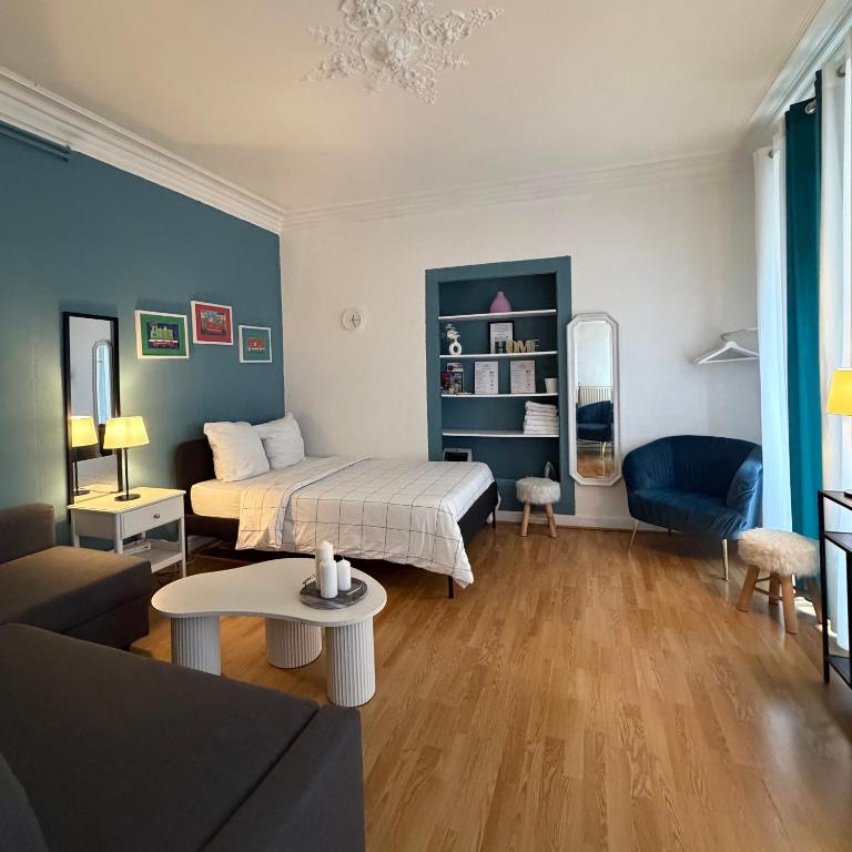 a living room with a bed and a couch at Hyper Centre Place Kléber Appart in Strasbourg