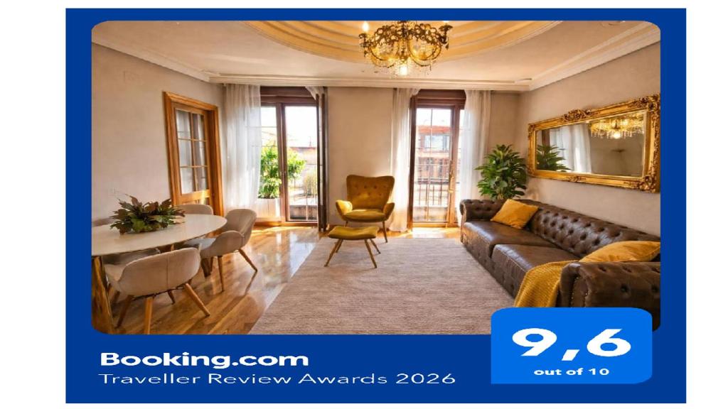 a living room with a couch and a table at Suite Legio VII in León