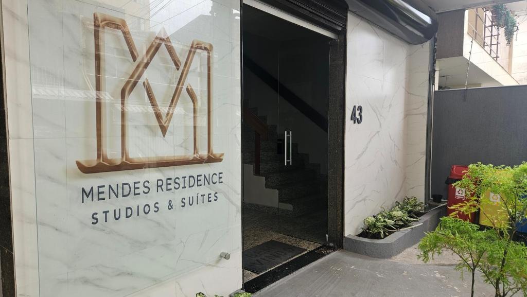 a sign on the side of a building with a door at Mendes Residence in Belém