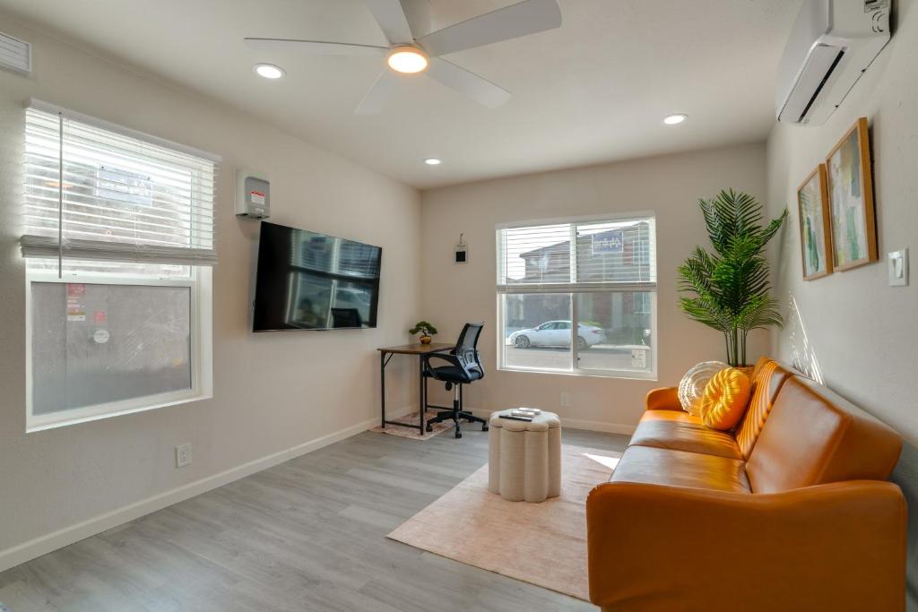 a living room with a couch and a tv at Great for Digital Nomads! Convenient Manteca Apt in Manteca