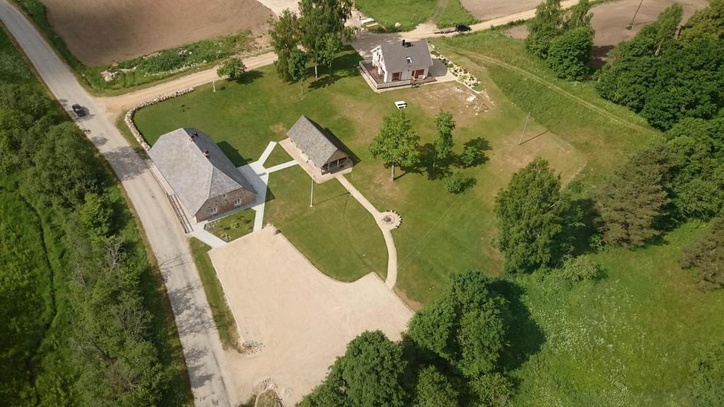 an overhead view of a large house in a yard at Vasekoja Historical House near Setomaa in Möldri