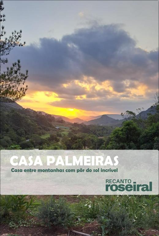 a sign that reads casa palmettes with a sunset in the background at Refúgio na Serra com Pôr do Sol in Feliz