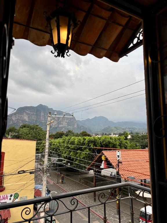 a view of the mountains from a balcony at Hotel-Posada Kali Tlayacapan in Tlayacapan