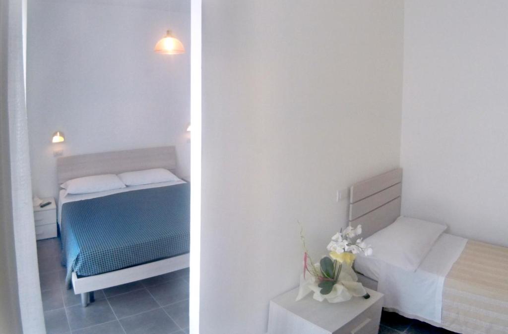 Postel nebo postele na pokoji v ubytování Hotel Atlas