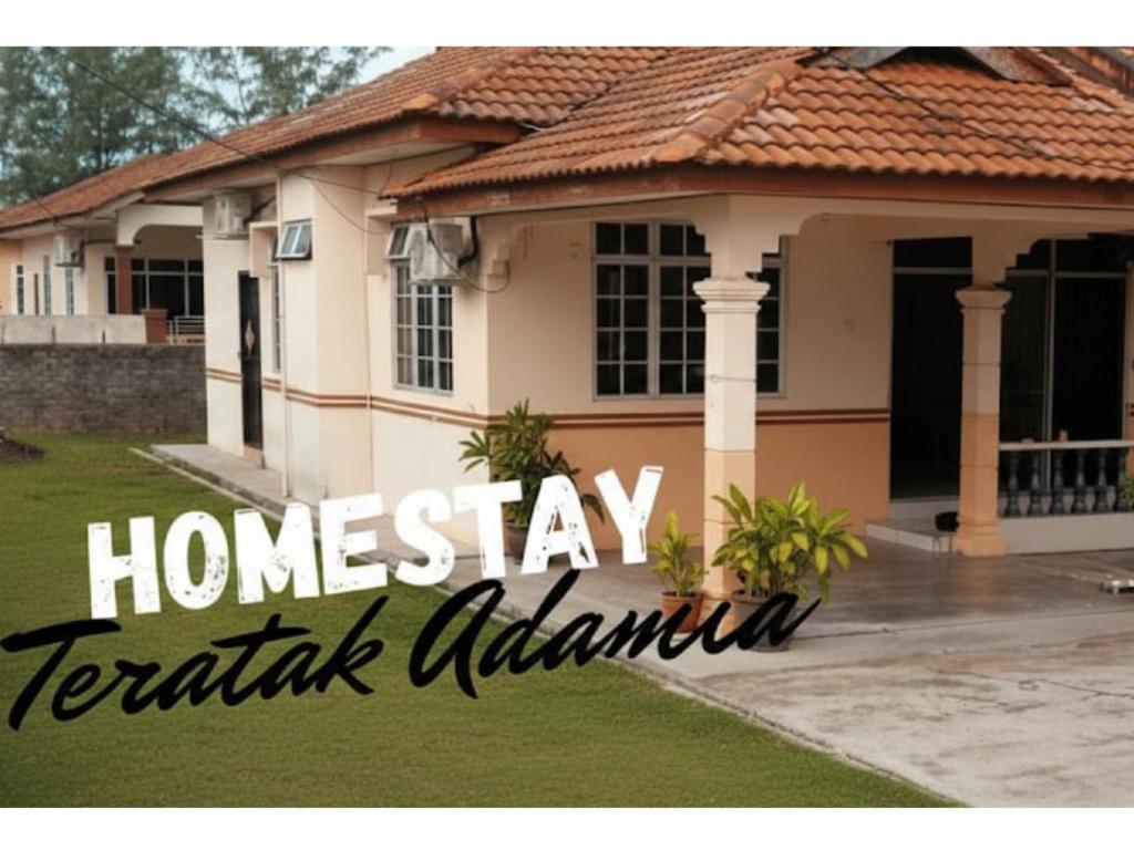 a house with the words home stay tahiti australia at Homestay Teratak Adamia in Dungun