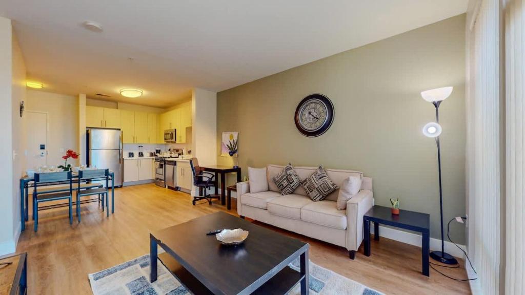a living room with a couch and a table at Elegant Home in Stamford