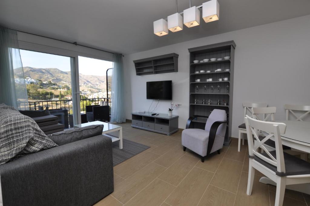 A television and/or entertainment centre at Casas Adosadas Lambda