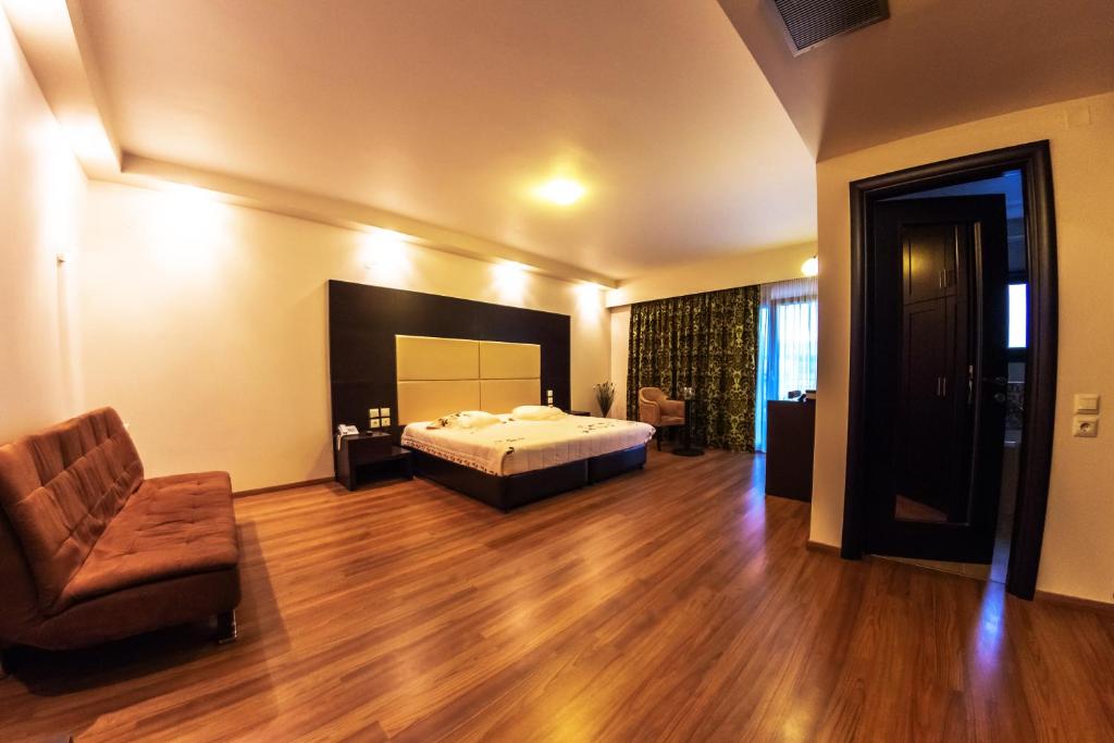 Postel nebo postele na pokoji v ubytování Giotis Boutique Hotel