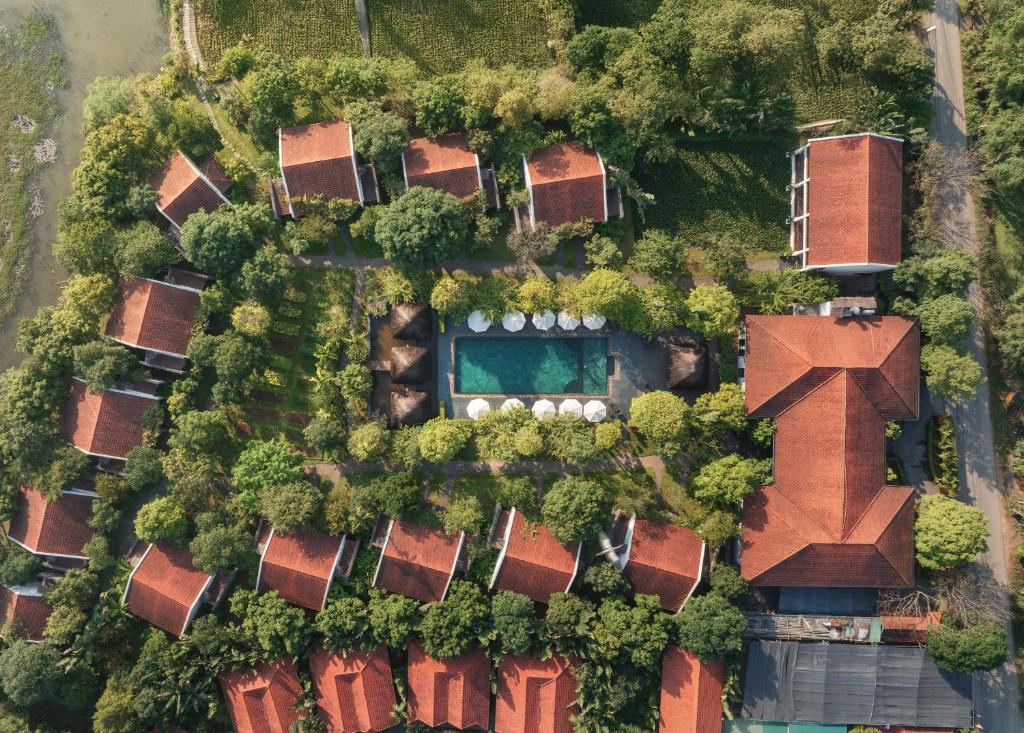 an aerial view of a house with trees at Aravinda Resort Ninh Binh in Ninh Binh