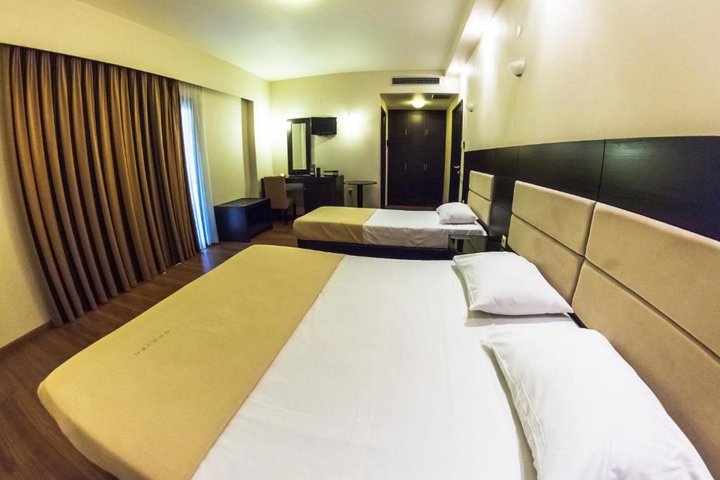 Postel nebo postele na pokoji v ubytování Giotis Boutique Hotel
