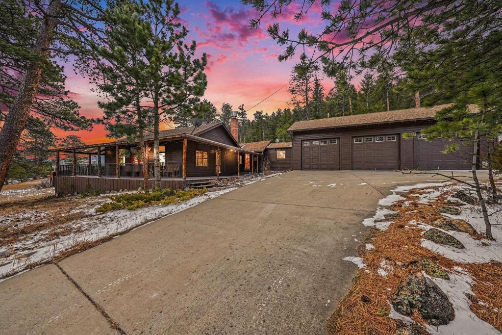 a house with a driveway and a garage at Twin Fawns - EV #3417 in Estes Park