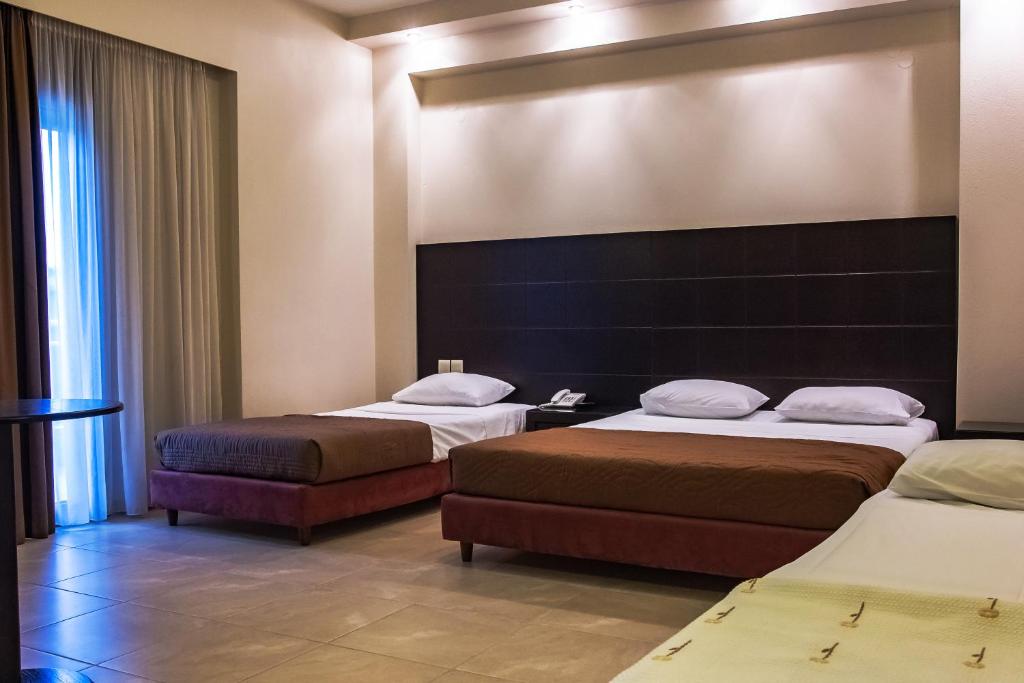 Postel nebo postele na pokoji v ubytování Giotis Boutique Hotel