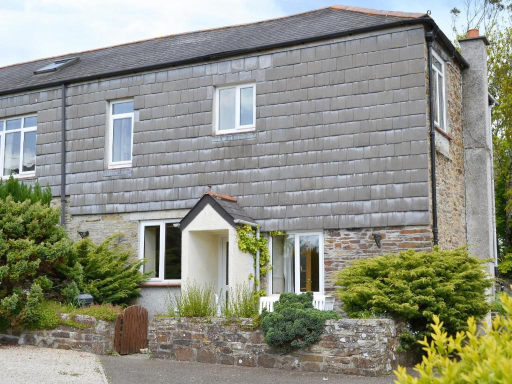 a stone house with a gray roof at Linhay - Ukc4242 in Lanreath