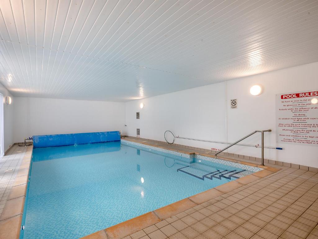a large indoor swimming pool in a building at Sandbanks in Bacton