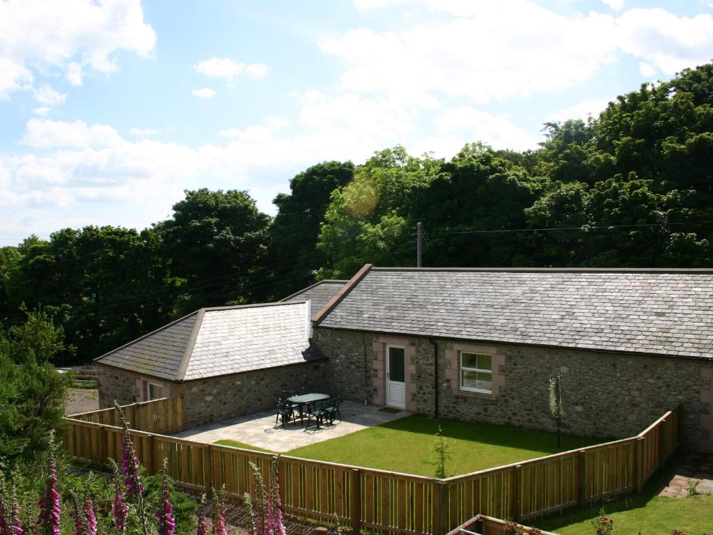a view of the cottage from the garden at Humbleton Falls in Wooler