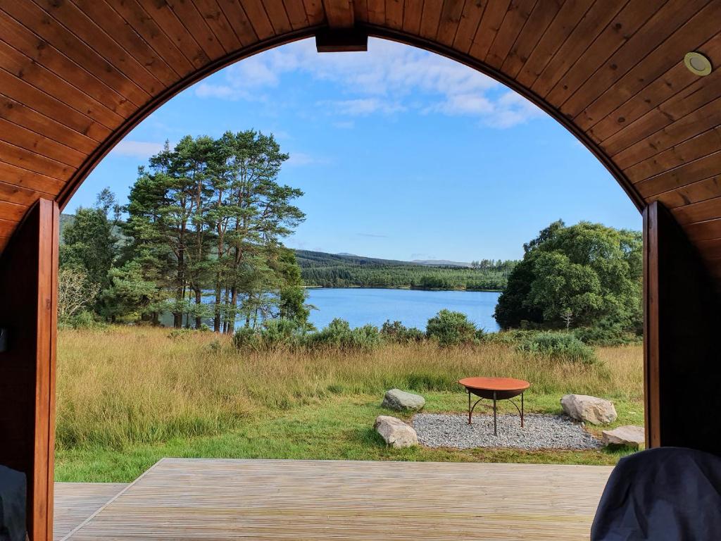 a table in a tent with a view of a lake at Here - Uk50566 in Port of Menteith