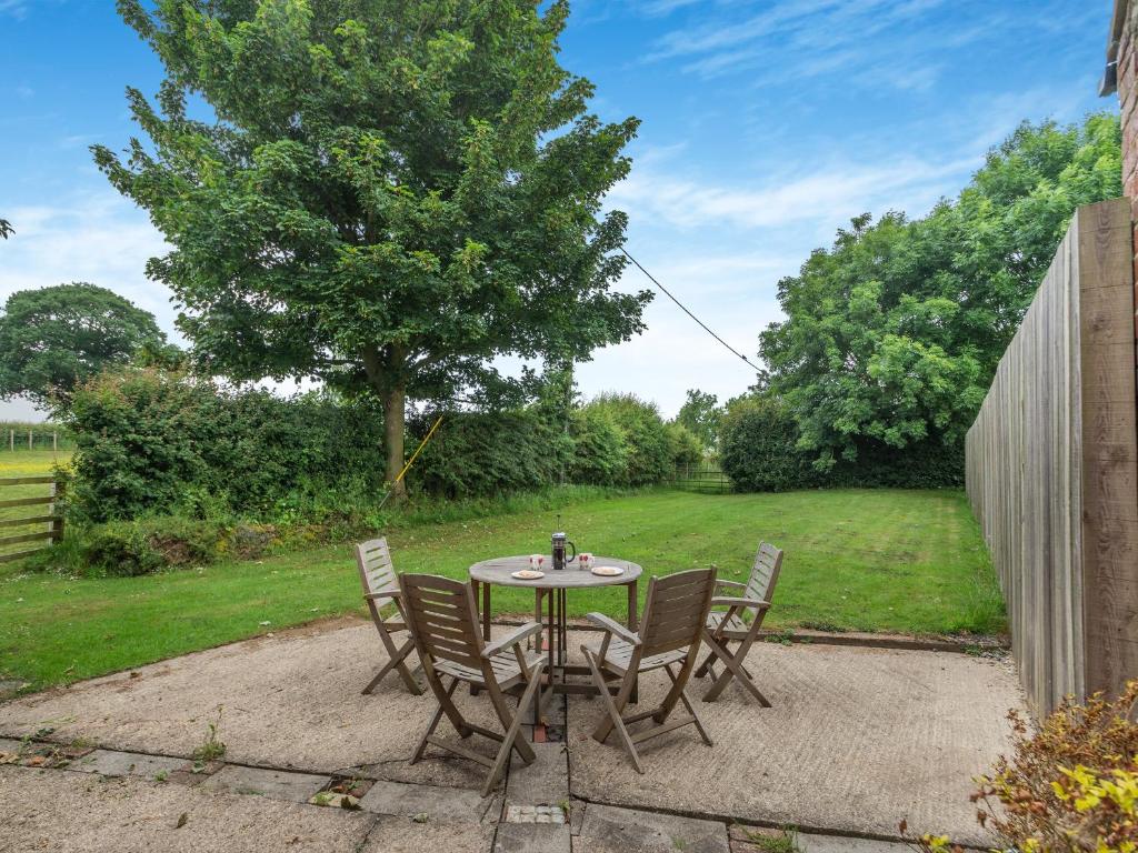 a patio with a table and chairs in a yard at The Granary - Uk44490 in Sedgefield