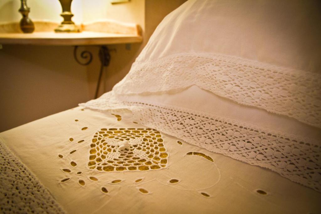 Postel nebo postele na pokoji v ubytování Albergo La Primula
