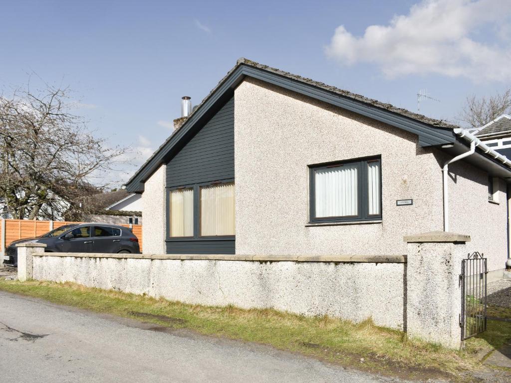 a house with a car parked in front of it at Cathwill in Newtonmore