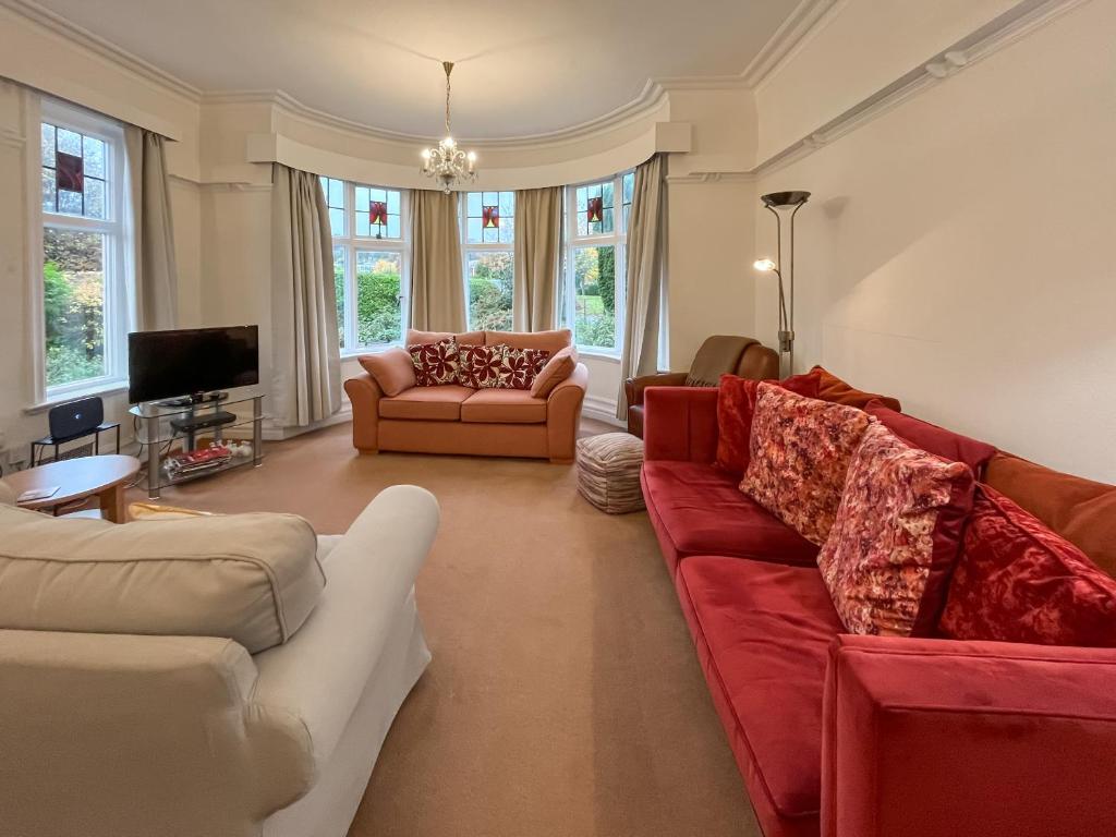 a living room with two couches and a tv at Seawinds - Uk50857 in Colwyn Bay