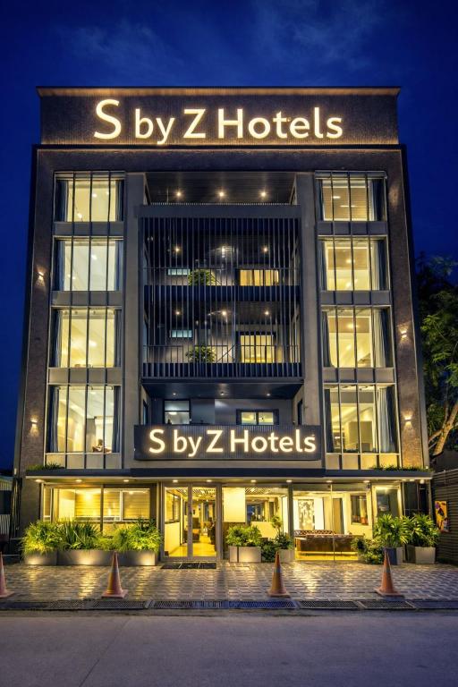 a building with a sign that reads by z hotels at S by Z Hotels, Baani Square in Gurgaon