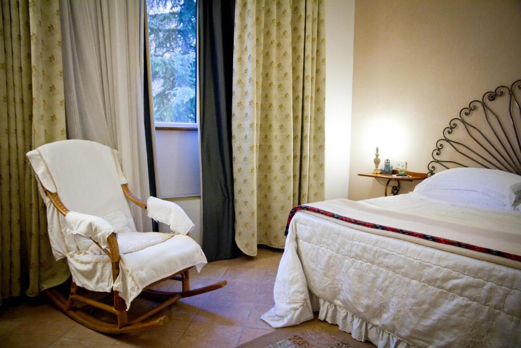 Postel nebo postele na pokoji v ubytování Albergo La Primula