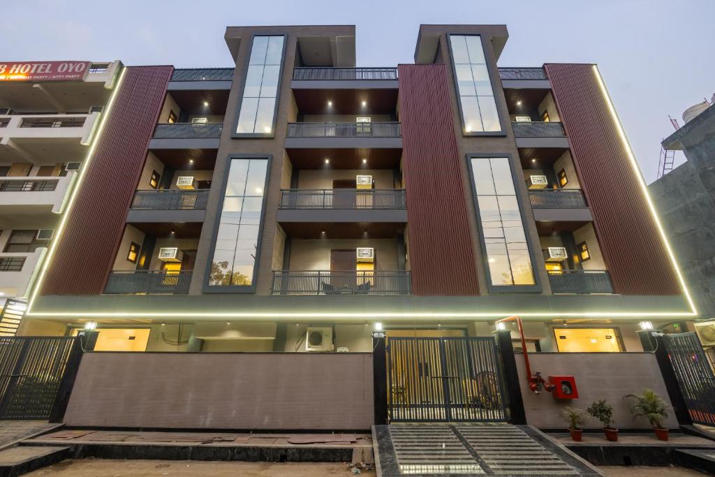 an apartment building with its lights on at Hotel Elite Clark in Noida