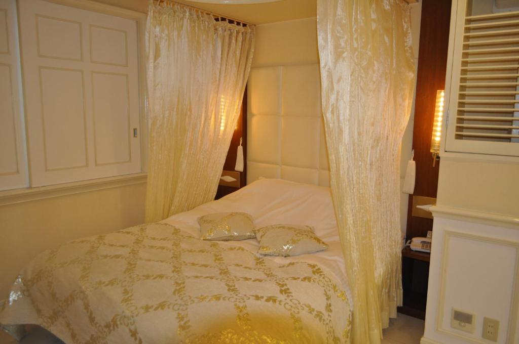 Postel nebo postele na pokoji v ubytování Hotel Woo (Adults Only)