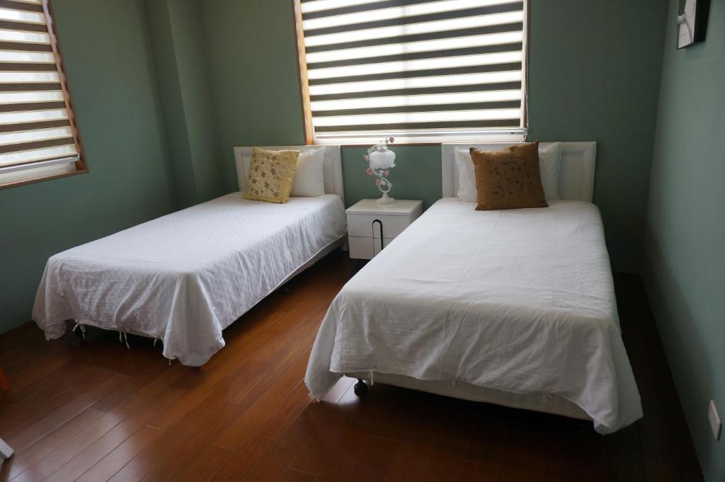 Cama o camas de una habitación en Dong Hua Dream House