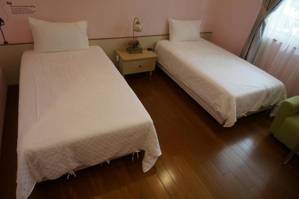 Cama o camas de una habitación en Dong Hua Dream House