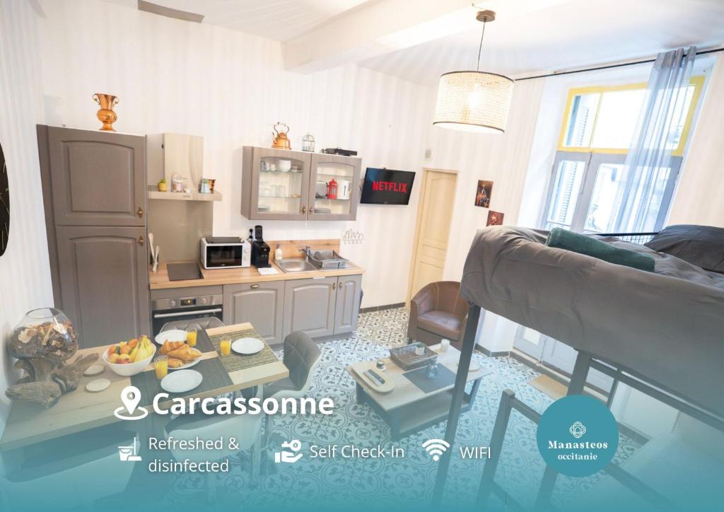 a living room with a table and a kitchen at Charming studio with sofa, bed and terrace-AS in Carcassonne