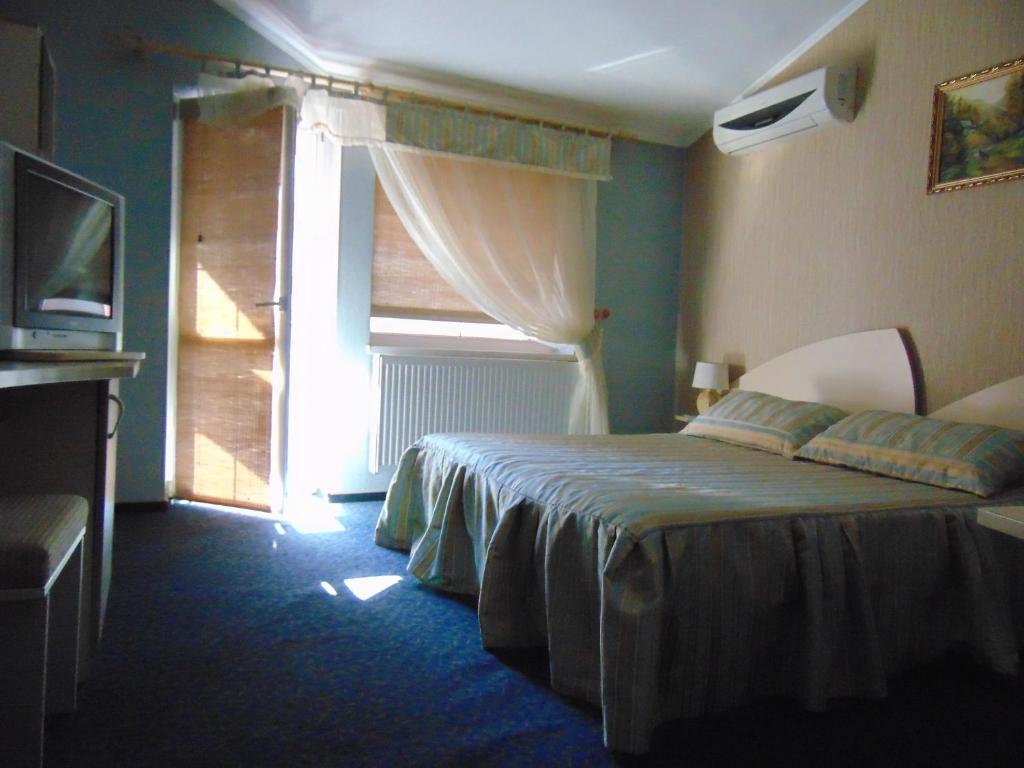 Postel nebo postele na pokoji v ubytování Hotel Serpanok