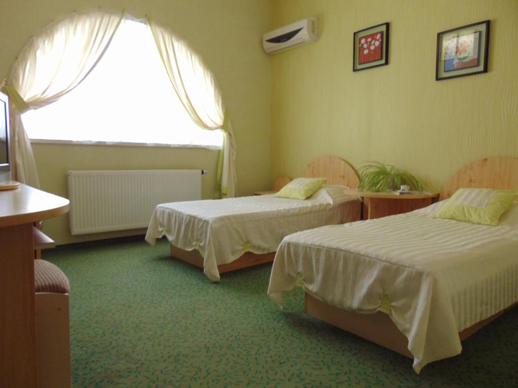 Postel nebo postele na pokoji v ubytování Hotel Serpanok