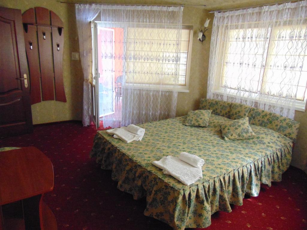 Postel nebo postele na pokoji v ubytování Hotel Serpanok