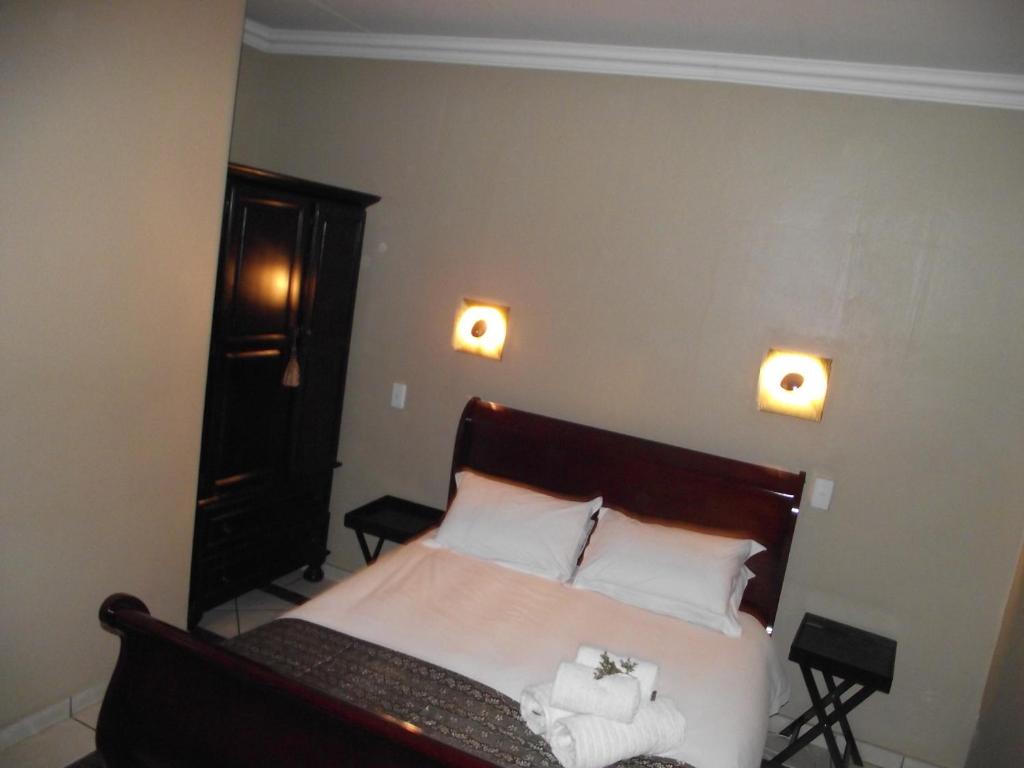 Säng eller sängar i ett rum på Njala Guest House