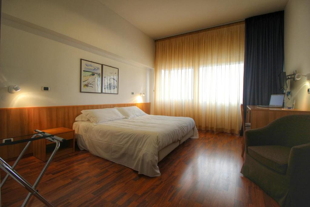 Postel nebo postele na pokoji v ubytování Hotel Majesty Bari