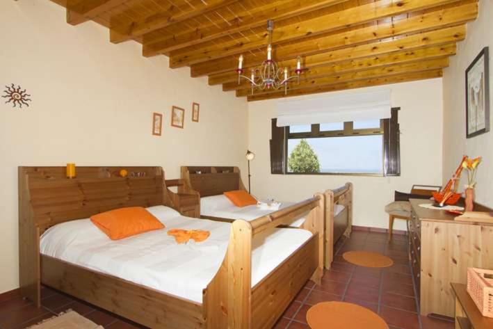 Postel nebo postele na pokoji v ubytování Villa Vista Graciosa