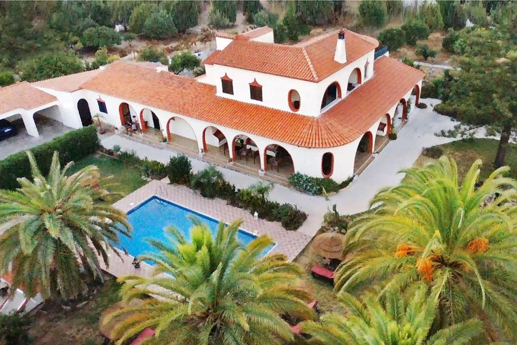 an overhead view of a large house with a swimming pool at Villa Paraiso - Naturism Optional Adults Only in Porches